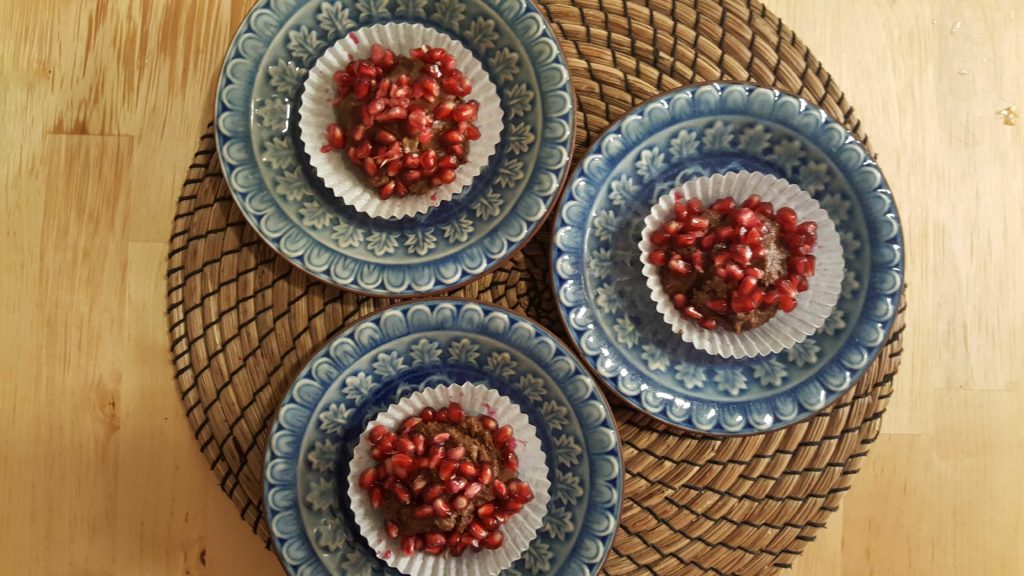 Chickpea Rum Chocolate Butter decorated with pomegranate seeds.